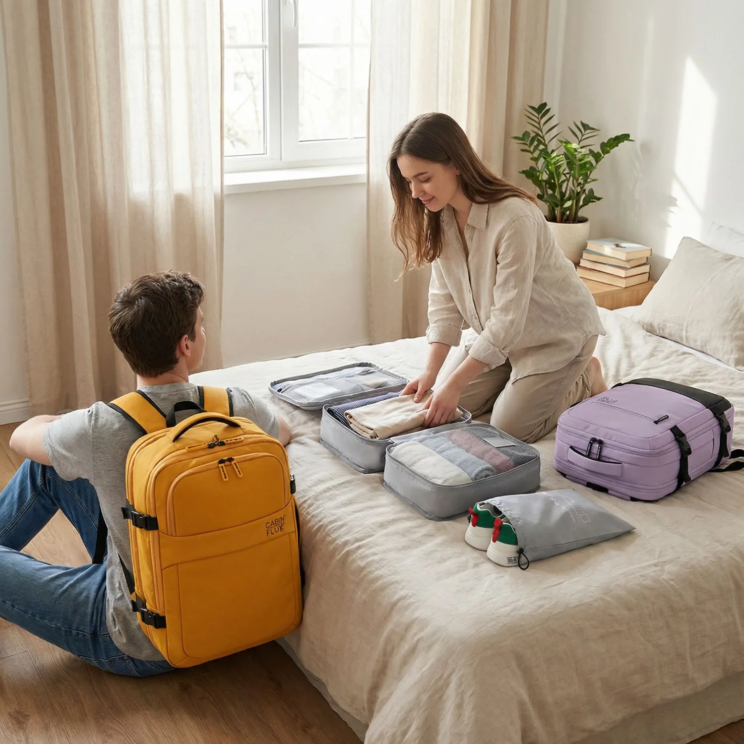 Packing a carry-on with folded clothes and packing cubes